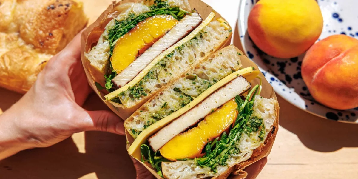 Best focaccia sandwich topped with grilled peaches and fresh ingredients