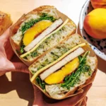 Best focaccia sandwich topped with grilled peaches and fresh ingredients